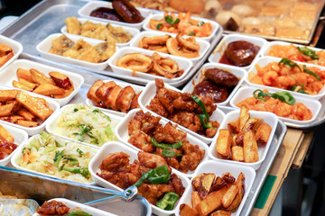 Closeup and crop variety Japanese snack and fried foods, Sale in Kuromon street market. It's so delicious and very cheap.