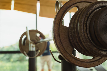 Empty fitness gymnasium with sport tools.Barbells for athlete exercise bodybuilding before match