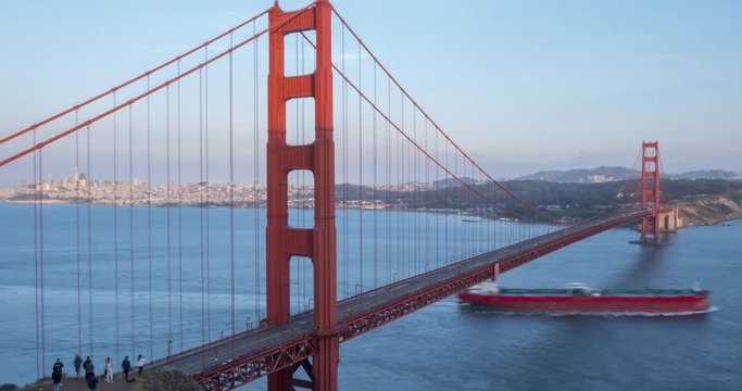 Time lapse of traffic on Golden Gate Bridge from Golden Gate Park at dusk, California, USA