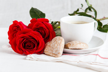 Cup of coffee and roses