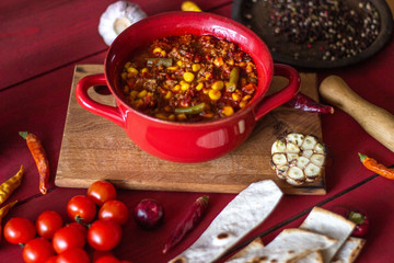 Chile con carne and ingredients for him. Mexican cuisine