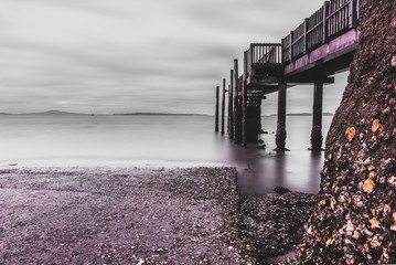 Coastal pier on cloudy day