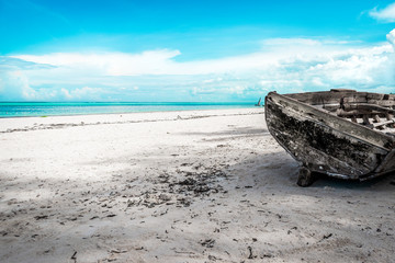 Matemwe Beach, Zanzibar, Tanzania, Africa - Old fishing boat in the foreground