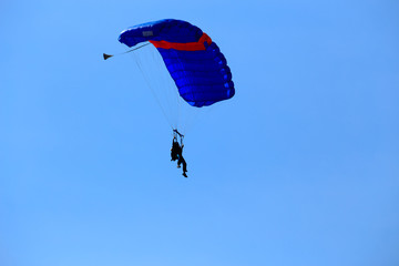 Soldiers show parachuting to allow children to watch on National Children's Day.