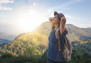 Naklejka premium Young beautiful woman traveler enjoys mountain, beautiful landscape and active lifestyle. Sri Lanka - Ceylon Island