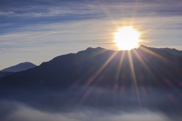 sun ray rise on mountains in the winter - 259854711