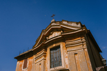 ROME, ITALY - 2018: Ancient chapel in Rome against the blue sky on a Sunny day