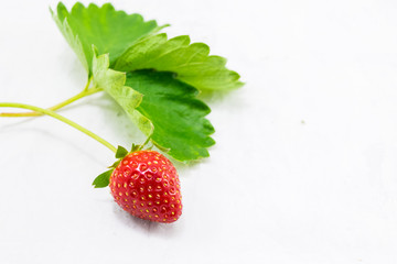 Stawberry with leaves on white