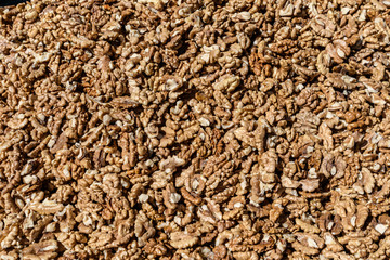 Large group of fresh walnut kernels sold at a spice food market, organic food background