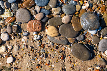 Beautiful pebbles on the beach close up