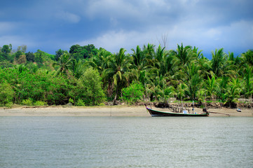 Boats  in beautiful sea beach with bright blue sky at Ranong ,Thailand