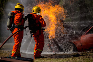 Firefighters are practicing fire fighting in a virtual situation.