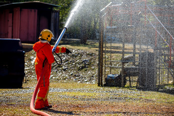 Firefighters is fighting fire with a  fire brigade and foam is completed