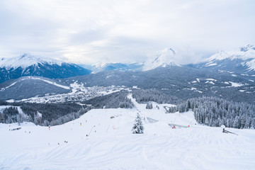 Winter landscape with snow covered Alps, ski slopes and aerial view of Seefeld in the Austrian state of Tyrol. Winter in Austria