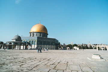unidentified tourists near the Dome of the Rock on the Temple Mount in the Old City of Jerusalem Israel. Large area in front of al-Aqsa mosque.