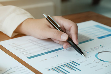 Business People Meeting Design Ideas  with pen analyzing financial documents professional investor working new start up project. Concept. business planning in office.