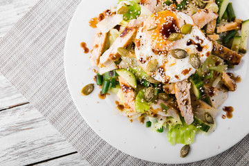 dietary salad with chicken breast, green beans, cucumber and egg