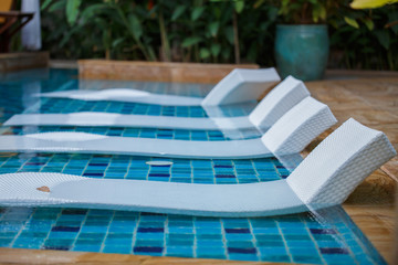 White beds in the pool