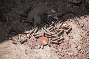 cartridges on the ground, the echo of war