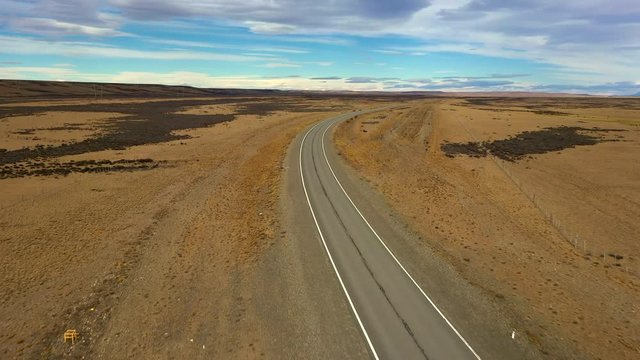 Aerial drone view of steppe landscape road in pampas of Patagonia, Argentina.