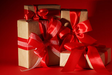 Gifts packed with craft paper and colorful satin ribbons	
