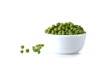 Green peas in a white bowl isolated on white background.