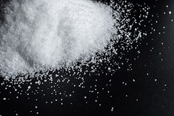 Fine salt on black background