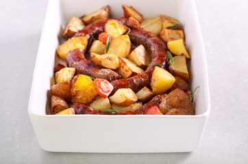 Sausages, potato and carrot baked