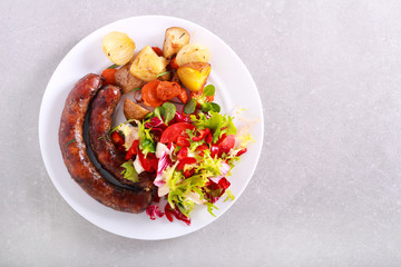 Grilled sausages and salad served