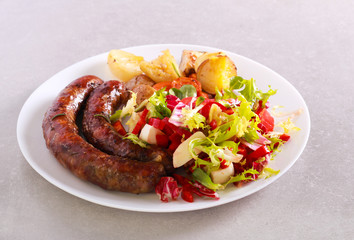 Grilled sausages and salad served