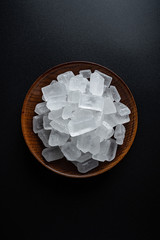 Single crystal rock sugar on black background