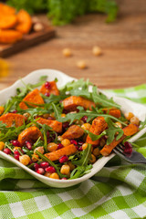 Sweet potato salad with lentils, pomegranates and rocket.