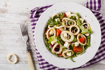 Salad with squid rings.
