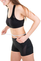 Slim girl with centimeter on white background