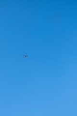 flying mechanism-drone in the blue sky, with space for text