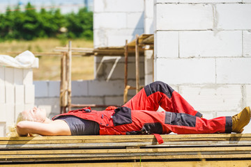 Woman taking break on construction site