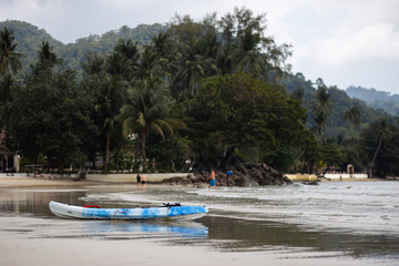 Fototapeta na wymiar A blue kayak boat on Ko Chang, Thailand in April, 2018 - Best travel destination for happiness
