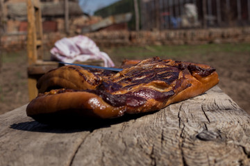 Whole Smoked Bacon Slab Resting On A Rustic Wooden Surface. Delicious Domestic Food