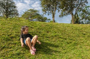 Little girl happy  playing slider with nature