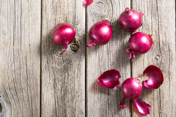 spanish onions on old rustic wood table background