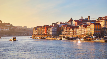 Portugal, Porto old town ribeira aerial promenade view with colorful houses, Douro river and boats.Concept of world travel, sightseeing and tourism
