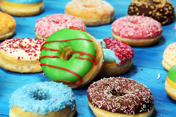 Obraz na płótnie Canvas donuts in different glazes with chocolate