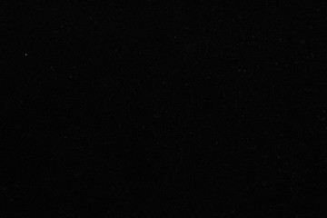 Fototapeta premium Black background, velvet paper texture, top view