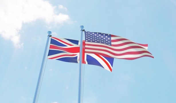 UK and USA, two flags waving against blue sky. 3d image