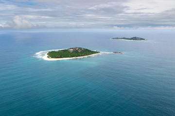 Naklejka na ściany i meble Aerial view of the small islands Cousin and Cousine, Seychelles in the Indian Ocean.