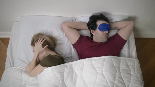woman who can not sleep because her husband snores