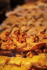 Puff pastry cakes in the form of a nest with nuts inside.