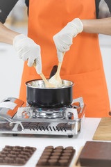 Woman making chocolate