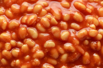 Baked beans in tomato sauce in white bowl
