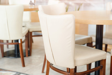 White chairs with wooden structure in interior restaurant